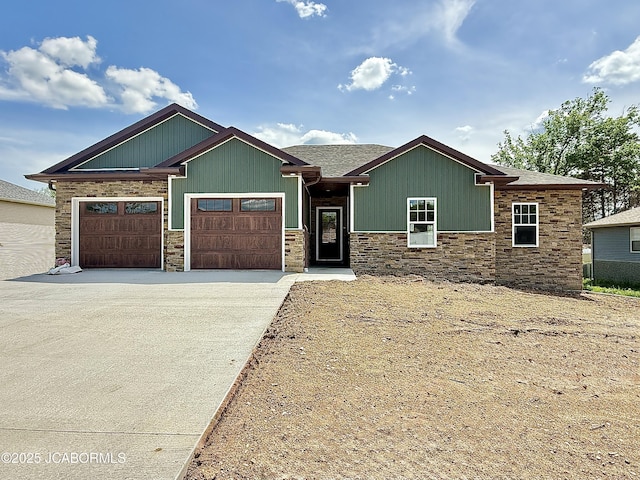 5519 Kenview Dr, Jefferson City, MO 65109 - craftsman house with a garage, stone siding, and driveway