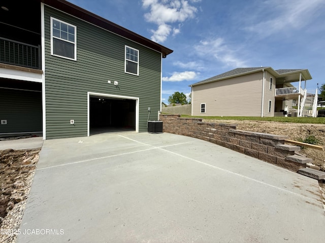 5519 Kenview Dr, Jefferson City, MO 65109 - view of side of property with an attached garage and concrete driveway