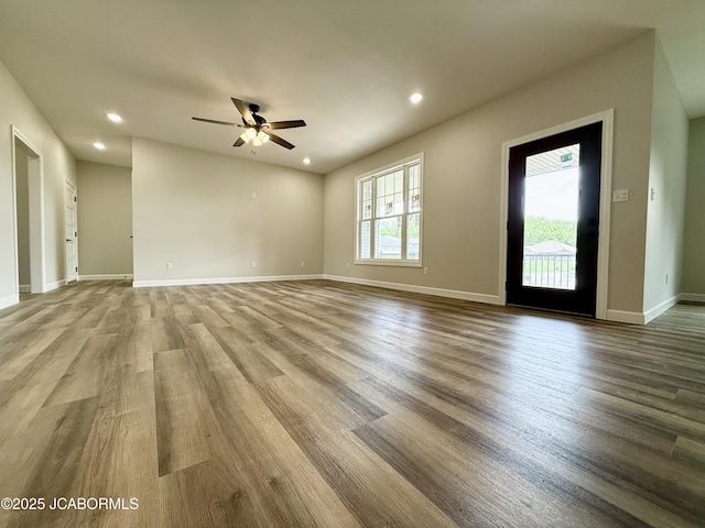 5519 Kenview Dr, Jefferson City, MO 65109 - unfurnished living room with recessed lighting, baseboards, a ceiling fan, and wood finished floors