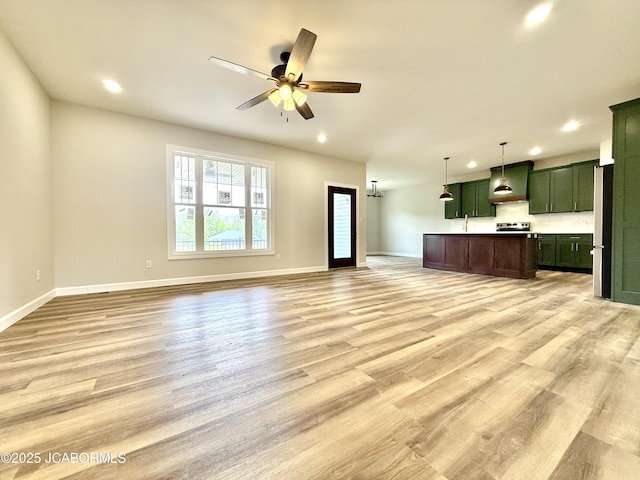 5519 Kenview Dr, Jefferson City, MO 65109 - unfurnished living room featuring a ceiling fan, a sink, light wood-type flooring, baseboards, and recessed lighting