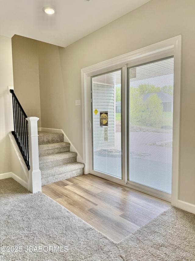 5519 Kenview Dr, Jefferson City, MO 65109 - doorway to outside with stairs, baseboards, and wood finished floors