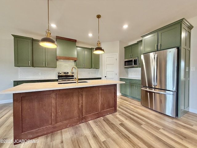 5519 Kenview Dr, Jefferson City, MO 65109 - kitchen with light countertops, stainless steel appliances, green cabinets, and a sink