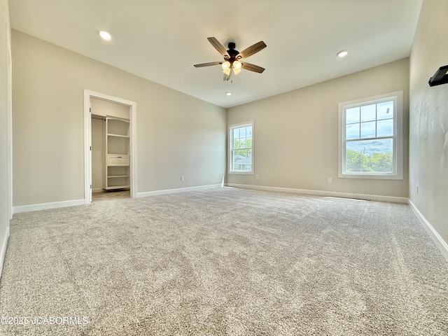 5519 Kenview Dr, Jefferson City, MO 65109 - unfurnished bedroom featuring a spacious closet, carpet floors, baseboards, and recessed lighting