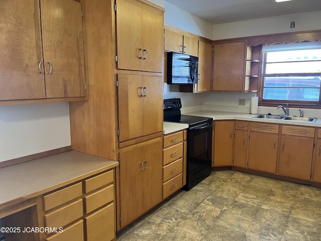 kitchen featuring sink and black appliances