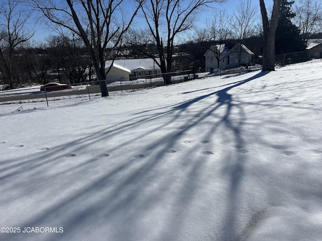 view of yard layered in snow