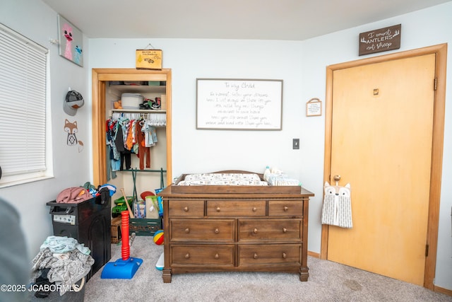 carpeted bedroom featuring a closet