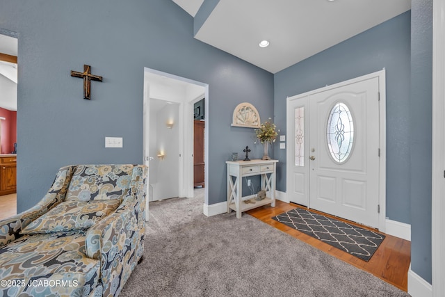 foyer featuring baseboards
