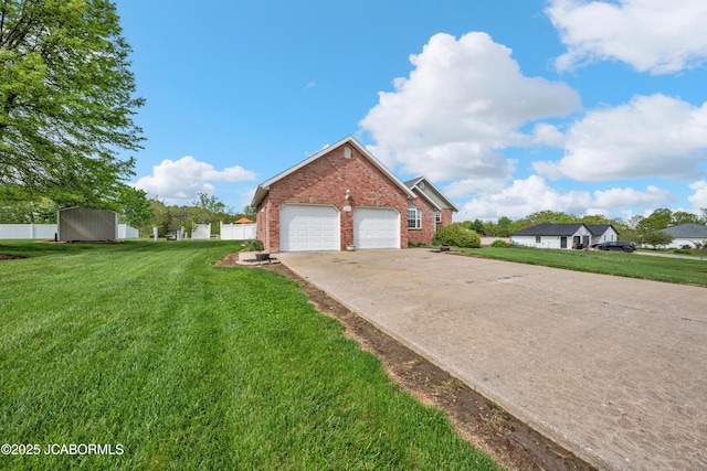 view of home's exterior featuring a lawn, a garage, driveway, and brick siding