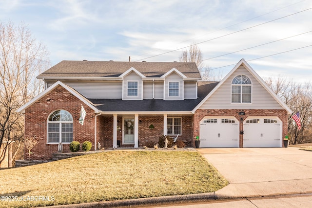 traditional-style home featuring a garage, brick siding, concrete driveway, and a front lawn