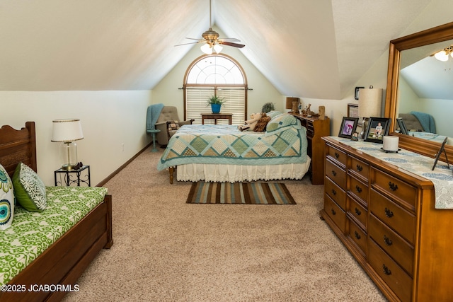 bedroom with baseboards, light colored carpet, and vaulted ceiling