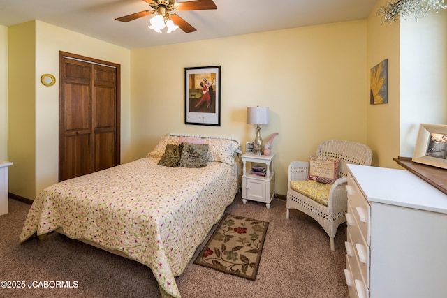 bedroom featuring baseboards, a closet, dark carpet, and ceiling fan