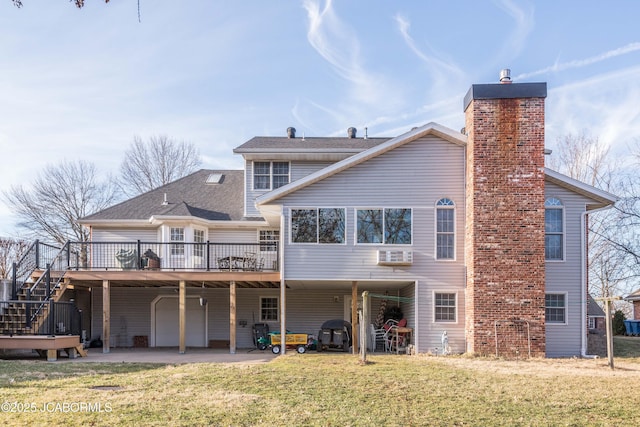 back of house featuring driveway, a yard, a chimney, a carport, and a deck