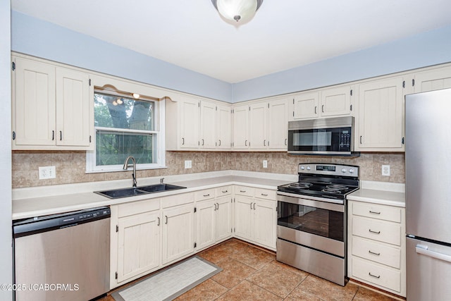 362 Vanhorn Rd, Holts Summit, MO 65043 - kitchen featuring stainless steel appliances, light countertops, tasteful backsplash, and light tile patterned floors