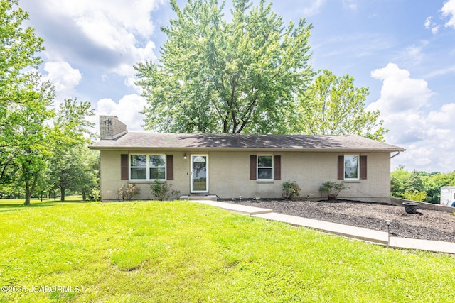 362 Vanhorn Rd, Holts Summit, MO 65043 - ranch-style house featuring a front lawn, brick siding, an outdoor fire pit, and a chimney