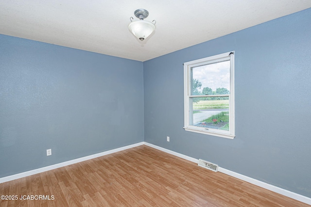 362 Vanhorn Rd, Holts Summit, MO 65043 - unfurnished room with wood finished floors