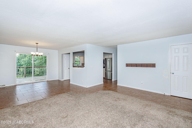 362 Vanhorn Rd, Holts Summit, MO 65043 - carpeted spare room featuring a chandelier and tile patterned floors