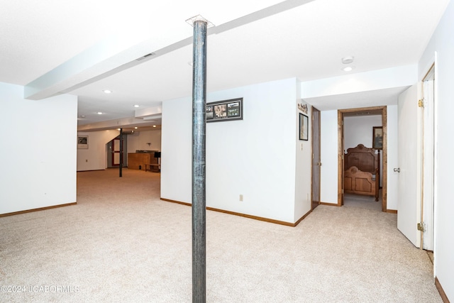 basement with light colored carpet