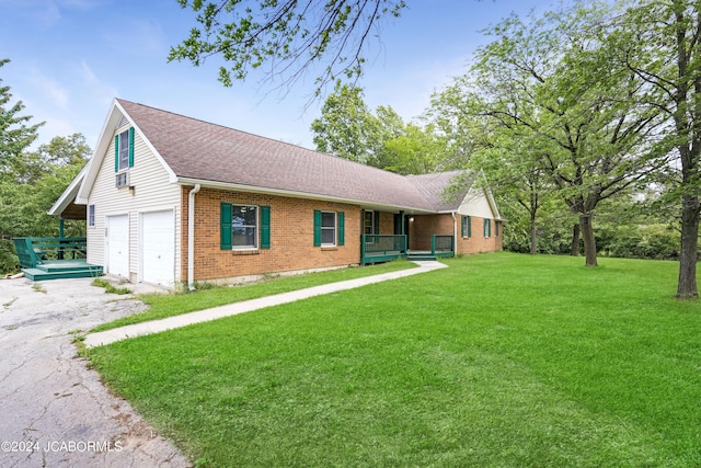 ranch-style house with a front yard, a porch, and a garage