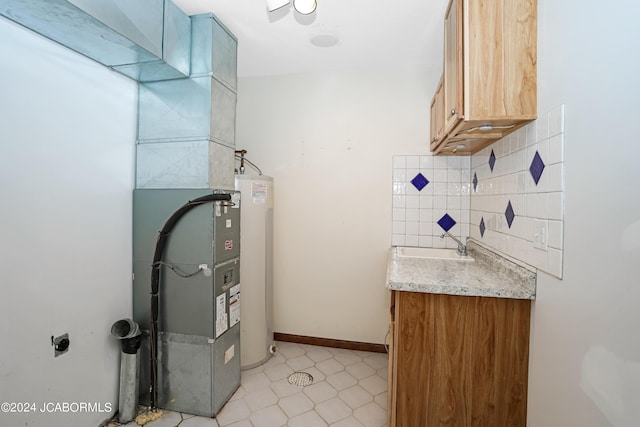 utility room with sink and water heater