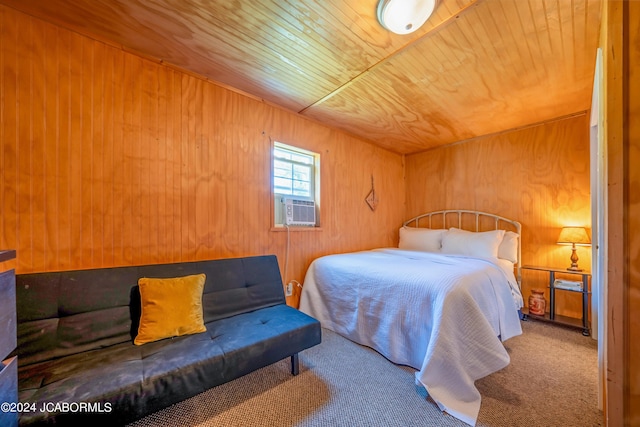 carpeted bedroom featuring wood walls, cooling unit, and wooden ceiling