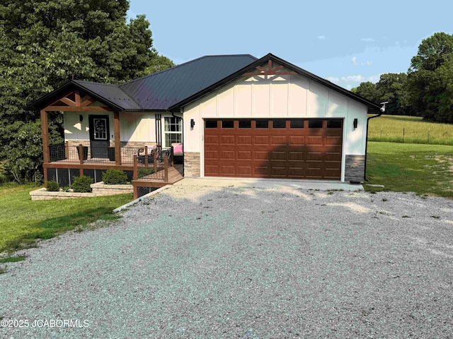 57421 Lake Imhoff Rd, California, MO 65018 - view of front of home with stone siding, board and batten siding, a garage, a front yard, and gravel driveway