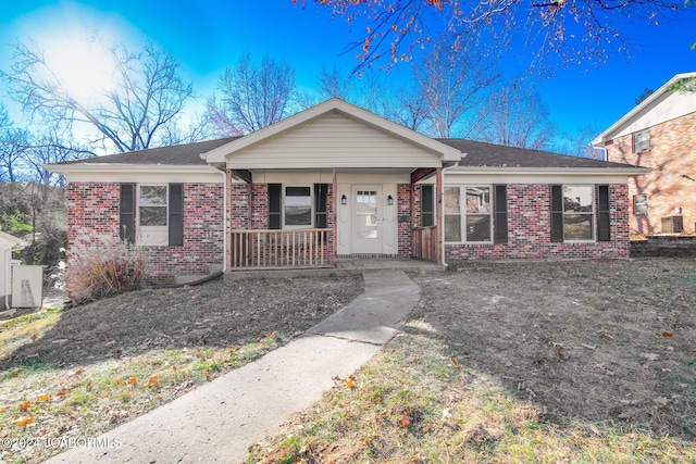 single story home featuring central AC and a porch