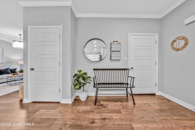 interior space featuring crown molding and hardwood / wood-style flooring