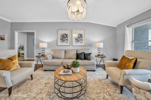 living room with crown molding and hardwood / wood-style flooring