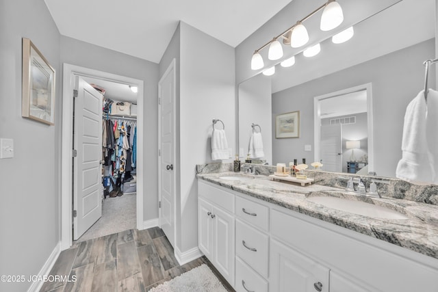 bathroom featuring vanity and hardwood / wood-style floors