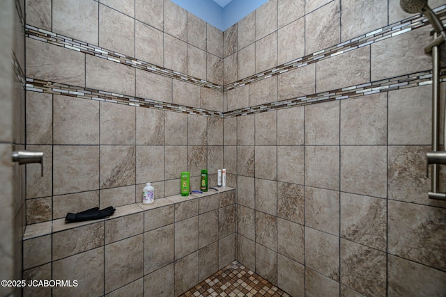 bathroom featuring tiled shower