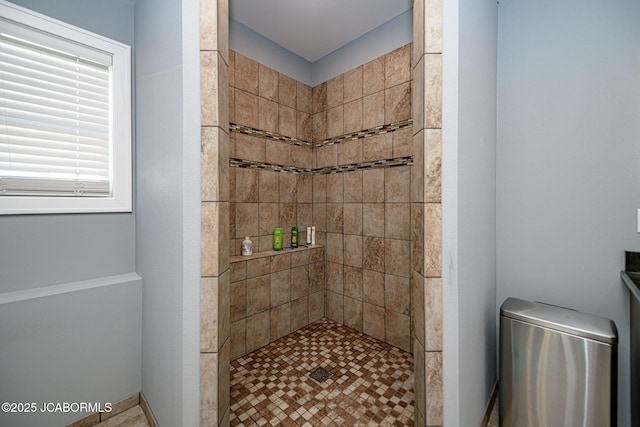 bathroom featuring a tile shower