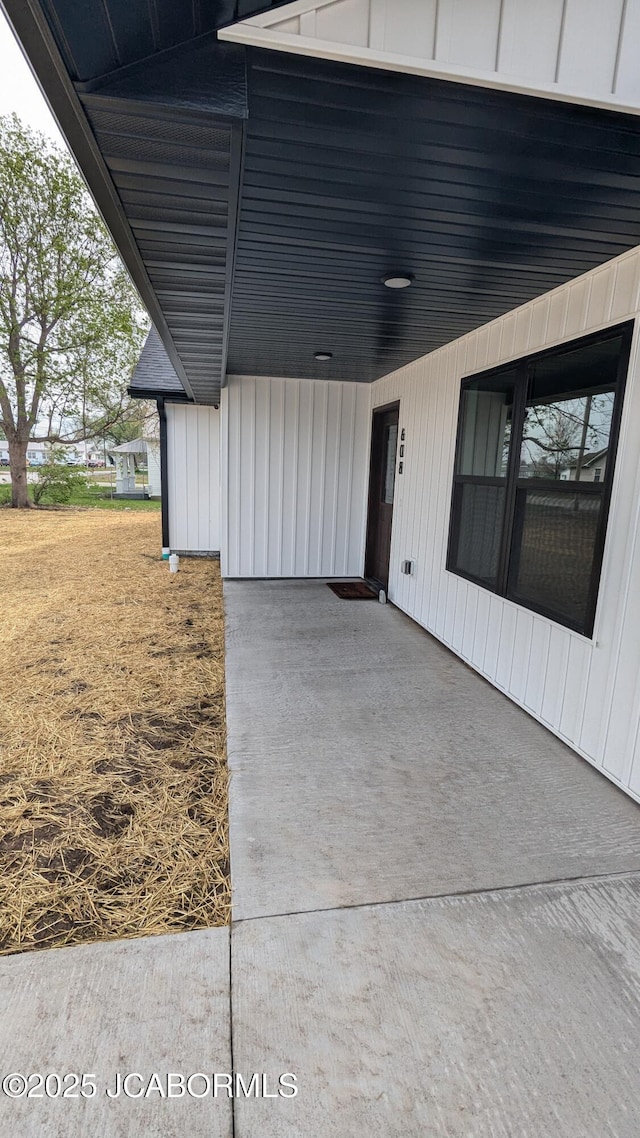 doorway to property with board and batten siding