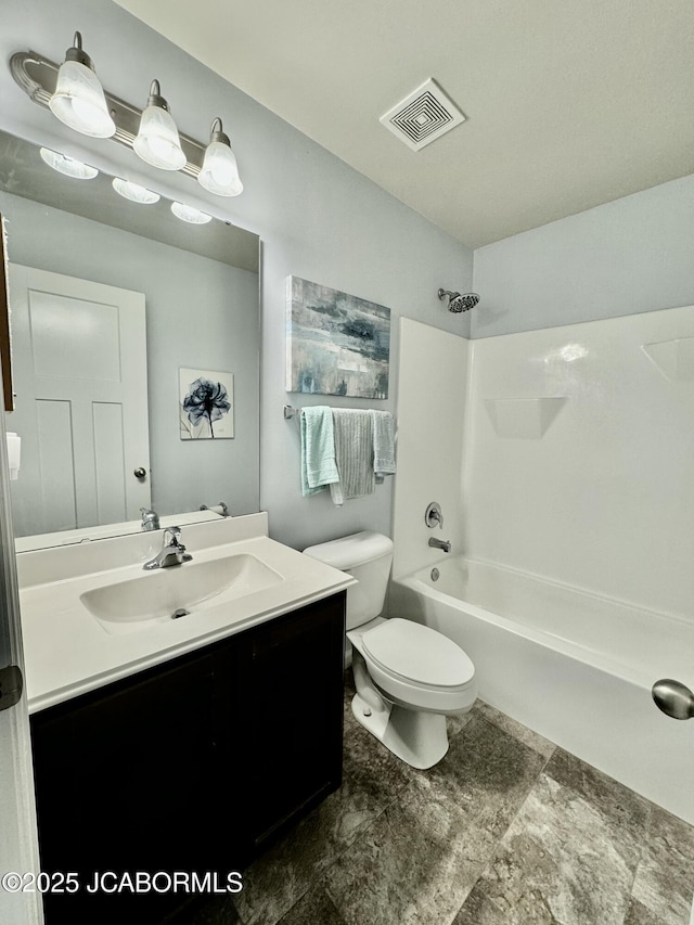 bathroom featuring toilet, washtub / shower combination, vanity, and visible vents