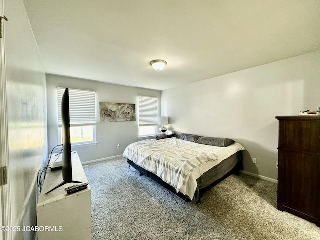 carpeted bedroom with baseboards