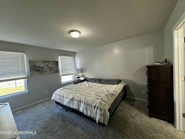 carpeted bedroom with baseboards