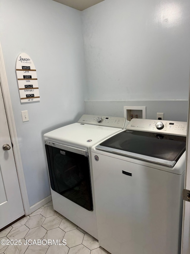 laundry room with laundry area, light tile patterned flooring, and independent washer and dryer