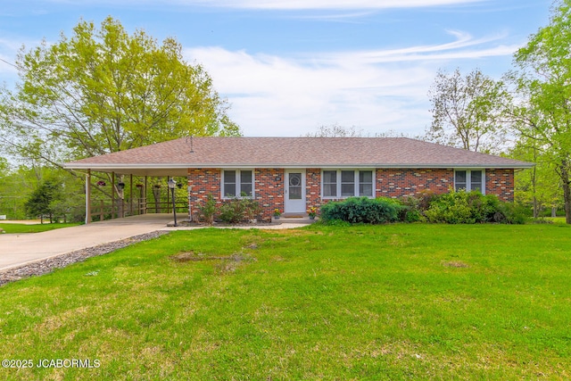 ranch-style house with an attached carport, concrete driveway, brick siding, and a front yard