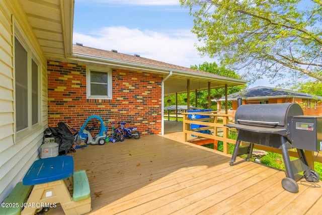 wooden deck with area for grilling
