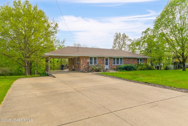 single story home with brick siding, a front lawn, driveway, and an attached carport