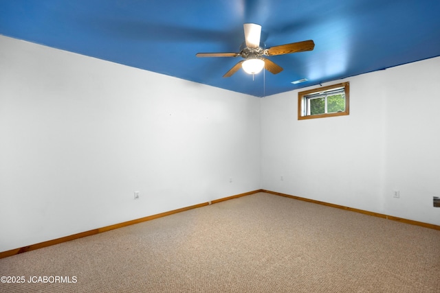 unfurnished room featuring baseboards, ceiling fan, and carpet flooring