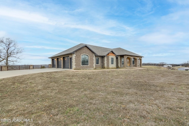 view of front of house with a garage and a front yard