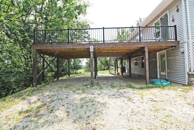 164 Turn Back Now Trl, Linn, MO 65051 - view of yard with a deck, stairway, and gravel driveway