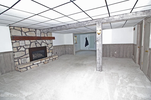 164 Turn Back Now Trl, Linn, MO 65051 - finished below grade area featuring a wainscoted wall, carpet flooring, wooden walls, and a stone fireplace
