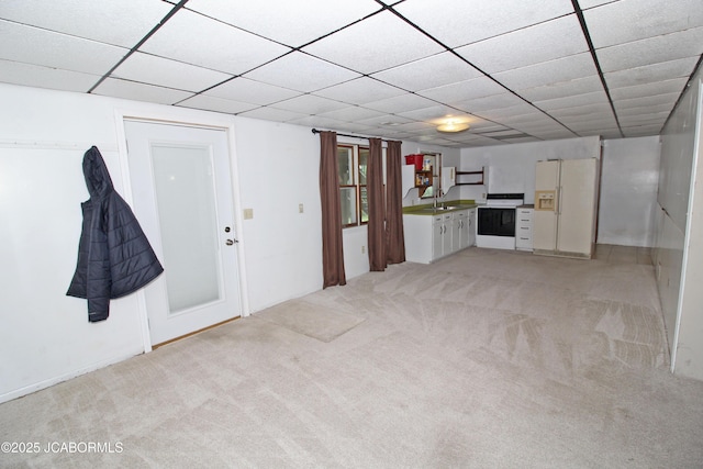 164 Turn Back Now Trl, Linn, MO 65051 - unfurnished living room with light carpet, a sink, and a paneled ceiling