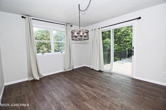 164 Turn Back Now Trl, Linn, MO 65051 - unfurnished room with a chandelier, dark wood finished floors, and baseboards