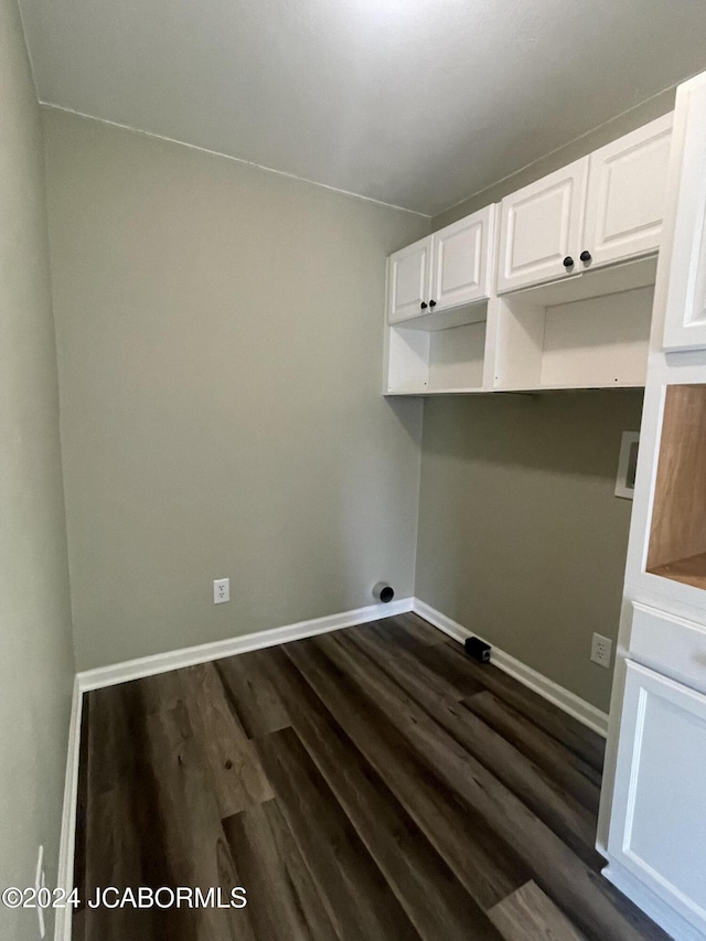 clothes washing area with hookup for an electric dryer, hookup for a washing machine, and dark hardwood / wood-style floors