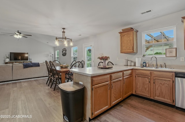 5112 Melissa Dr, Columbia, MO 65202 - kitchen featuring stainless steel dishwasher, light wood-type flooring, light countertops, a ceiling fan, and lofted ceiling