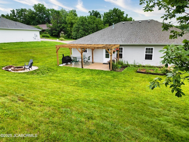 5112 Melissa Dr, Columbia, MO 65202 - back of house with an outdoor fire pit, a pergola, a patio area, a lawn, and a shingled roof
