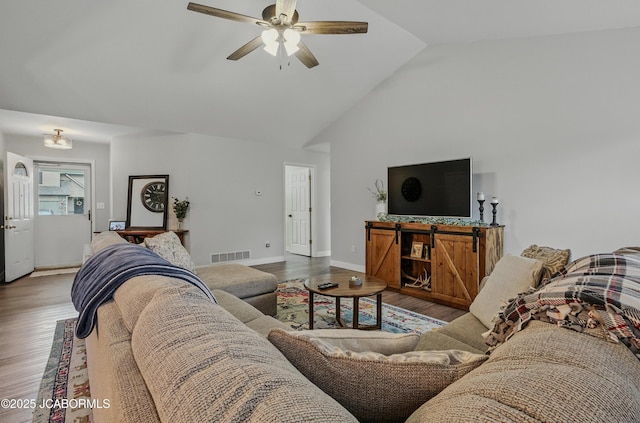 5112 Melissa Dr, Columbia, MO 65202 - living room featuring wood finished floors, ceiling fan, and high vaulted ceiling