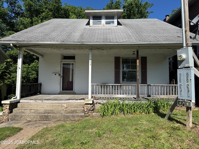 204 Havana St, Jefferson City, MO 65109 - bungalow featuring covered porch and brick siding